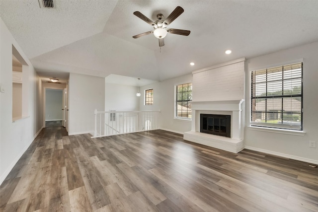 7616 Jamie Renee Ln, North Richland Hills, TX 76182 - unfurnished living room featuring wood finished floors, ceiling fan, recessed lighting, baseboards, and a large fireplace
