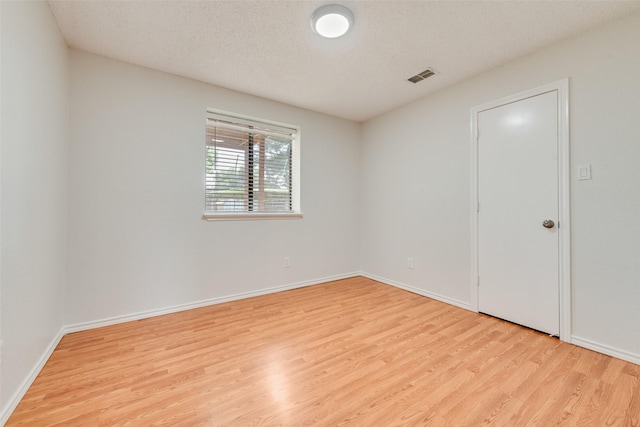 7616 Jamie Renee Ln, North Richland Hills, TX 76182 - spare room with wood finished floors and baseboards