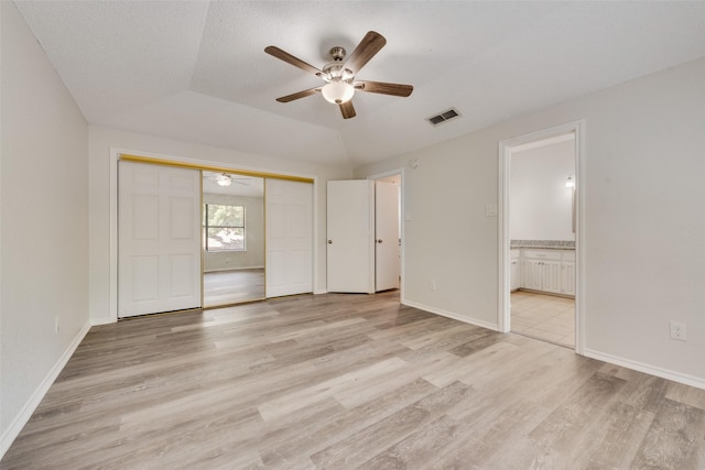 7616 Jamie Renee Ln, North Richland Hills, TX 76182 - unfurnished bedroom with light wood-type flooring, connected bathroom, baseboards, a closet, and ceiling fan