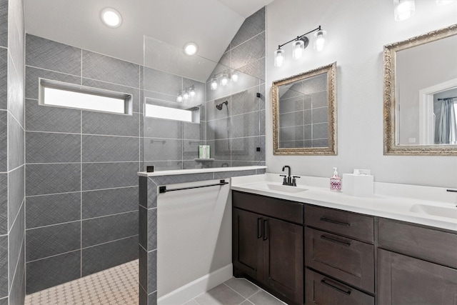 3817 Stonewood Dr, Little Elm, TX 75068 - bathroom with lofted ceiling, double vanity, walk in shower, and tile patterned floors