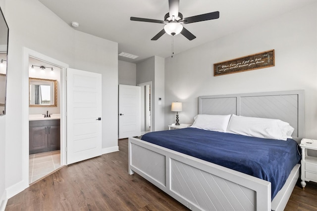 3817 Stonewood Dr, Little Elm, TX 75068 - bedroom with wood finished floors, a sink, ensuite bath, baseboards, and ceiling fan
