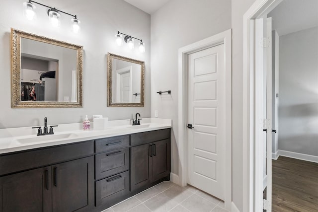3817 Stonewood Dr, Little Elm, TX 75068 - bathroom with double vanity and baseboards