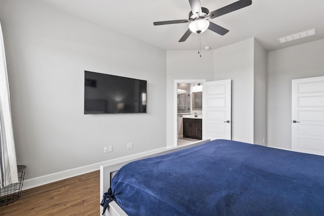 3817 Stonewood Dr, Little Elm, TX 75068 - bedroom featuring wood finished floors, baseboards, ensuite bathroom, and a ceiling fan