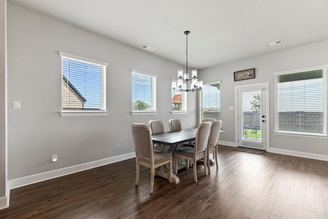 3817 Stonewood Dr, Little Elm, TX 75068 - dining space with a chandelier, dark wood-style floors, and baseboards