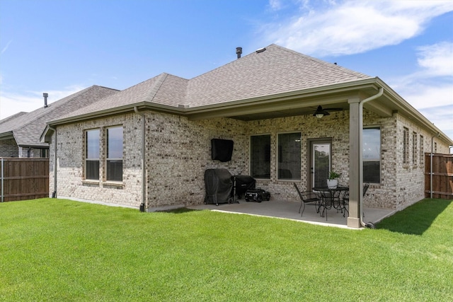 3817 Stonewood Dr, Little Elm, TX 75068 - rear view of property with a shingled roof, brick siding, a patio area, and a ceiling fan