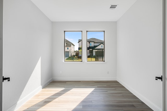 4251 Arlington Ave, Mckinney, TX 75071 - unfurnished room featuring wood finished floors and baseboards