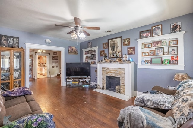 890 Vine St, Abilene, TX 79602 - living room featuring wood finished floors, a fireplace, and ceiling fan