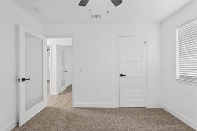 1427 Oriole Blvd, Duncanville, TX 75116 - spare room featuring carpet, a ceiling fan, and baseboards