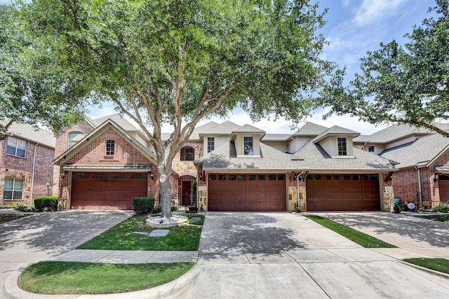 4721 Bayview Dr, Plano, TX 75093 - view of front of home with stone siding, driveway, and a garage