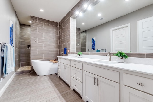 5913 Lewis St, Dallas, TX 75206 - full bath with double vanity, a soaking tub, recessed lighting, and a tile shower