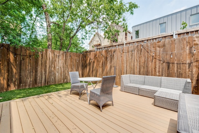 5913 Lewis St, Dallas, TX 75206 - wooden deck with outdoor lounge area and a fenced backyard