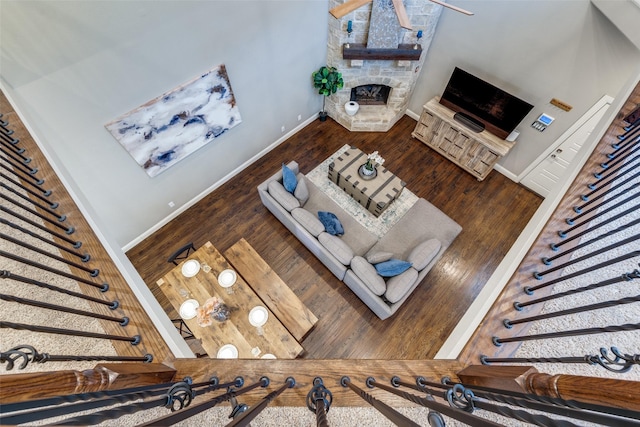 5913 Lewis St, Dallas, TX 75206 - living room with baseboards, wood finished floors, and a fireplace