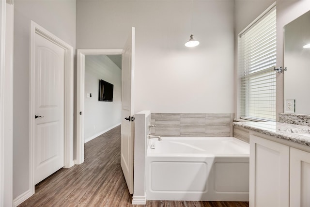 760 E Northside Dr, Pilot Point, TX 76258 - bathroom with vanity, a bath, and wood finished floors