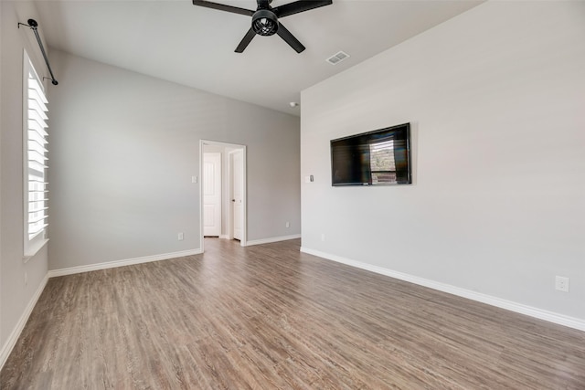 760 E Northside Dr, Pilot Point, TX 76258 - spare room with a ceiling fan, wood finished floors, and baseboards
