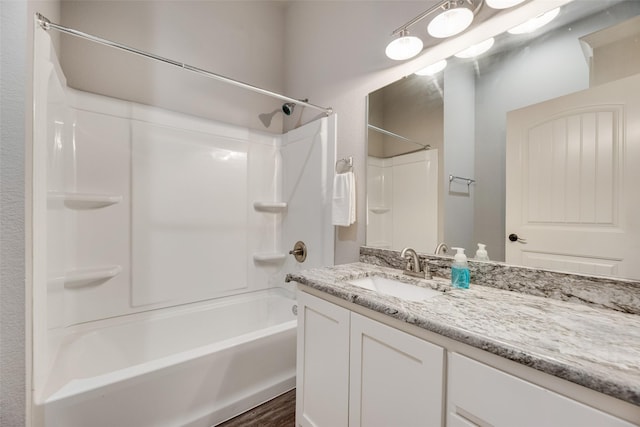 760 E Northside Dr, Pilot Point, TX 76258 - full bathroom with vanity, washtub / shower combination, and wood finished floors