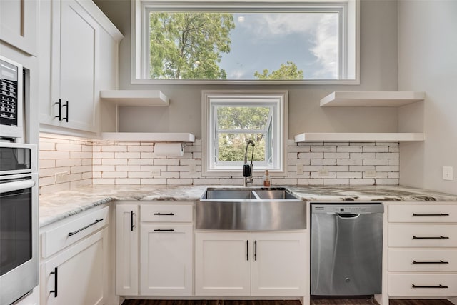 760 E Northside Dr, Pilot Point, TX 76258 - kitchen with open shelves, stainless steel appliances, a sink, white cabinets, and decorative backsplash