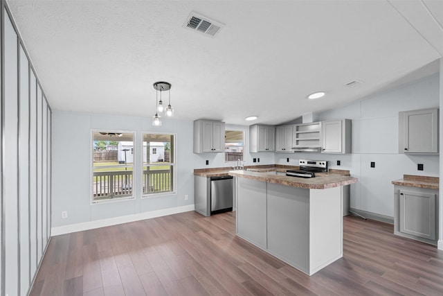 430 Indian Hills Rd, Bowie, TX 76230 - kitchen with stainless steel appliances, gray cabinetry, dark wood-style flooring, open shelves, and vaulted ceiling