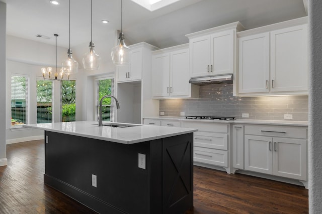 7340 San Felipe Dr, Irving, TX 75039 - kitchen featuring a sink, decorative backsplash, stainless steel gas stovetop, dark wood-style flooring, and recessed lighting