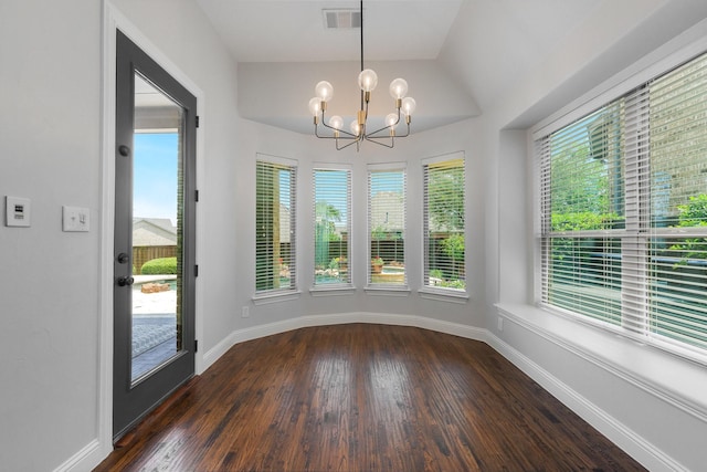 7340 San Felipe Dr, Irving, TX 75039 - unfurnished dining area with a chandelier, dark wood-type flooring, baseboards, and vaulted ceiling