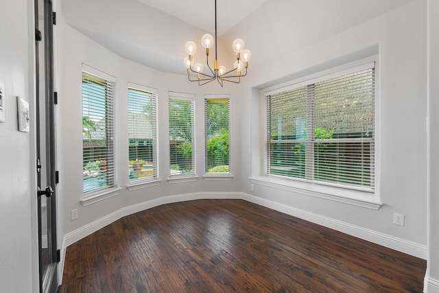 7340 San Felipe Dr, Irving, TX 75039 - unfurnished dining area featuring healthy amount of natural light, a chandelier, dark wood-style floors, and baseboards