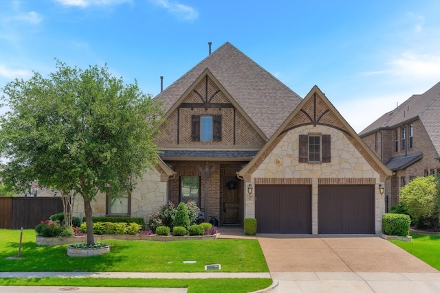 7340 San Felipe Dr, Irving, TX 75039 - tudor home with stone siding, a shingled roof, concrete driveway, and an attached garage