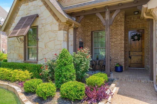 7340 San Felipe Dr, Irving, TX 75039 - doorway to property with stone siding, brick siding, and a porch