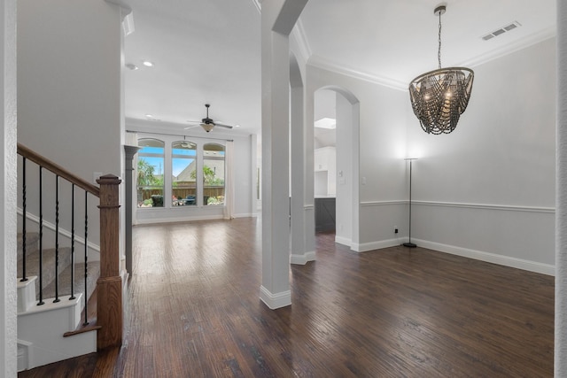7340 San Felipe Dr, Irving, TX 75039 - foyer featuring a ceiling fan, arched walkways, a chandelier, baseboards, and ornamental molding