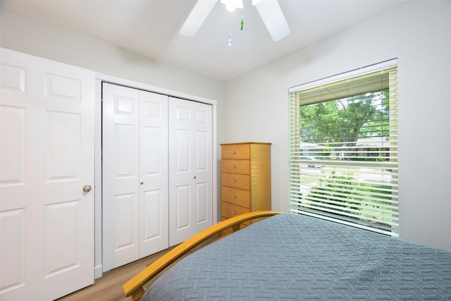 909 Redwood Dr, Richardson, TX 75080 - bedroom featuring wood finished floors, a closet, and ceiling fan
