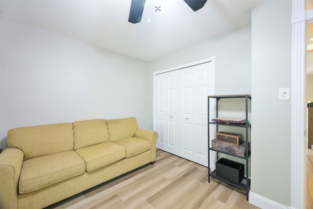 909 Redwood Dr, Richardson, TX 75080 - living room with light wood-type flooring, ceiling fan, and baseboards
