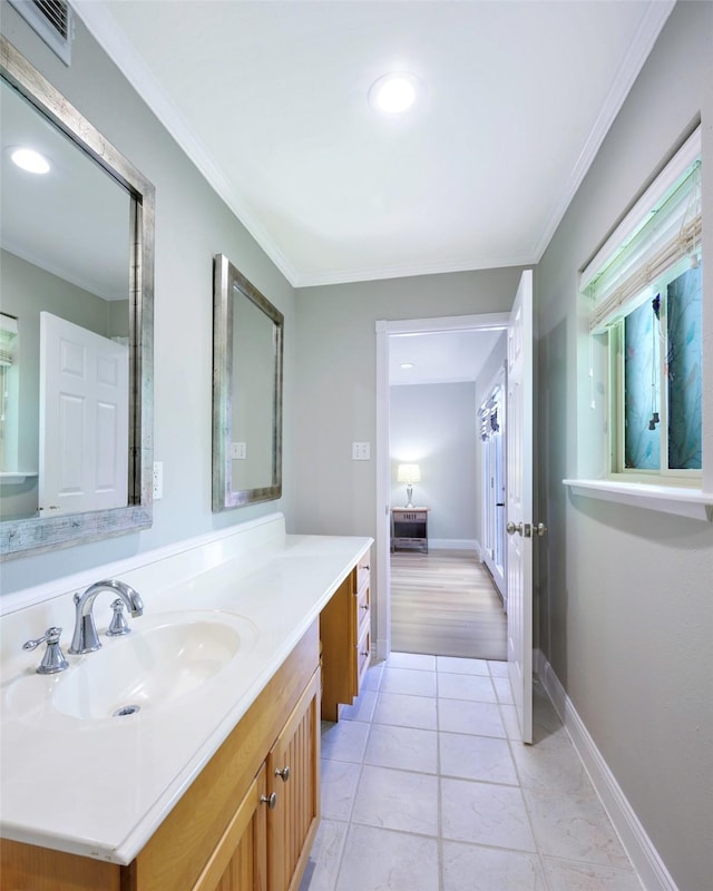 909 Redwood Dr, Richardson, TX 75080 - bathroom with ornamental molding, vanity, tile patterned floors, recessed lighting, and baseboards
