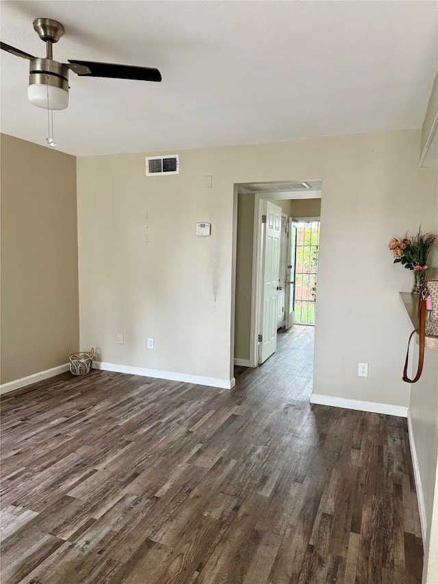 1503 N Garrett Ave Unit 109, Dallas, TX 75206 - unfurnished room with dark wood-style flooring, ceiling fan, and baseboards