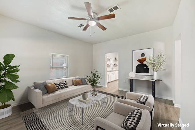 1806 Maryland Ave, Dallas, TX 75216 - living room with wood finished floors, ceiling fan, and baseboards