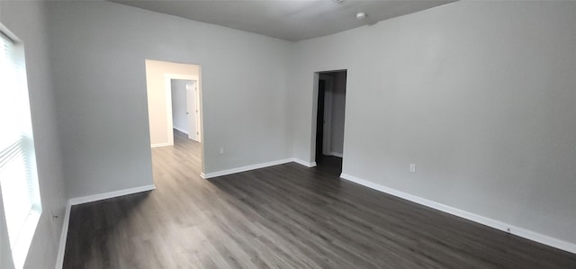 1806 Maryland Ave, Dallas, TX 75216 - spare room featuring dark wood-type flooring and baseboards