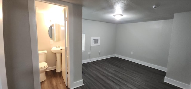 1806 Maryland Ave, Dallas, TX 75216 - unfurnished bedroom with dark wood finished floors, baseboards, and ensuite bath