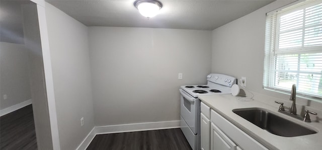 1806 Maryland Ave, Dallas, TX 75216 - kitchen with electric range, a sink, plenty of natural light, and light countertops