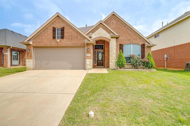 420 Fairbrook Ln, Fort Worth, TX 76140 - view of front of home featuring a garage, concrete driveway, stone siding, brick siding, and a front yard