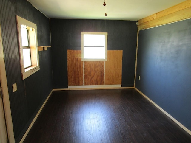 841 S 5th Ave, Munday, TX 76371 - empty room with dark wood finished floors and baseboards