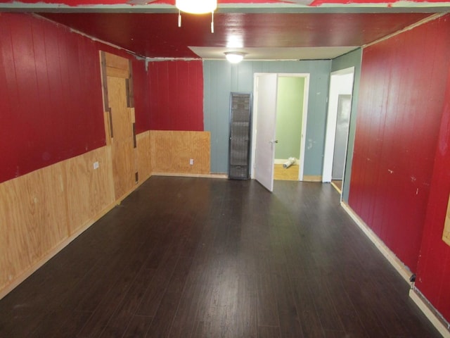 841 S 5th Ave, Munday, TX 76371 - unfurnished room with wood walls and wood finished floors