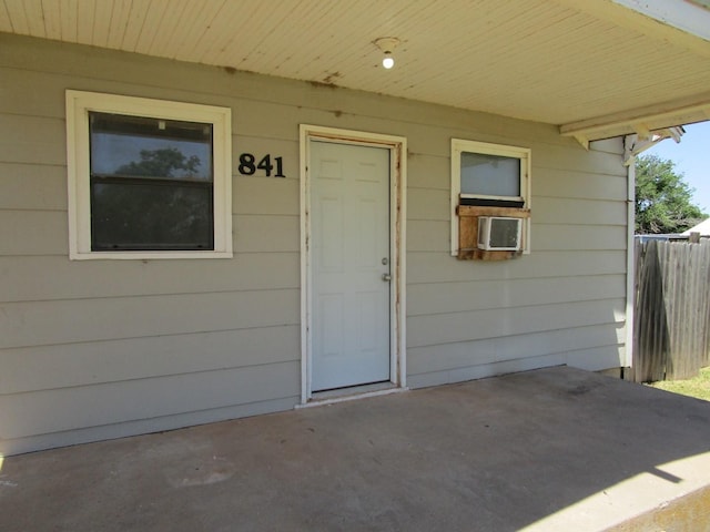 841 S 5th Ave, Munday, TX 76371 - doorway to property with a patio and cooling unit