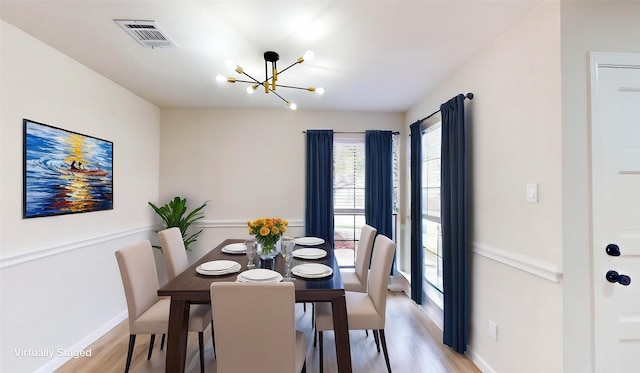 6916 Moccasin Dr, Plano, TX 75023 - dining space with a chandelier, light wood-style flooring, and baseboards