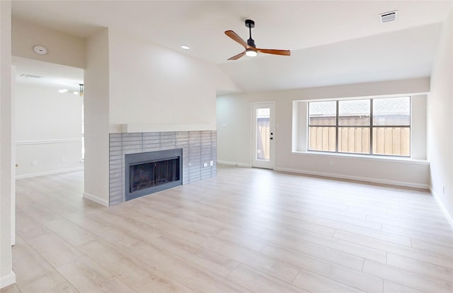 6916 Moccasin Dr, Plano, TX 75023 - unfurnished living room featuring ceiling fan, a brick fireplace, wood finished floors, vaulted ceiling, and baseboards