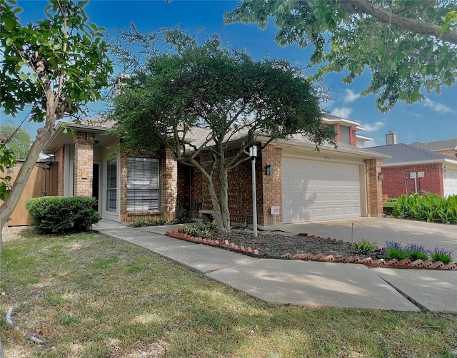 6916 Moccasin Dr, Plano, TX 75023 - view of front of property featuring a garage, concrete driveway, and brick siding