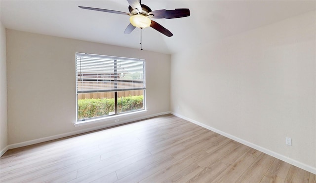 6916 Moccasin Dr, Plano, TX 75023 - spare room featuring light wood-type flooring, a ceiling fan, and baseboards