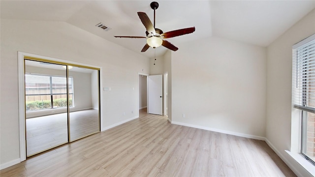 6916 Moccasin Dr, Plano, TX 75023 - unfurnished bedroom with lofted ceiling, light wood finished floors, a closet, and baseboards