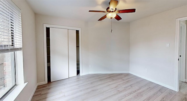 6916 Moccasin Dr, Plano, TX 75023 - unfurnished bedroom featuring light wood-style floors, a closet, baseboards, and a ceiling fan
