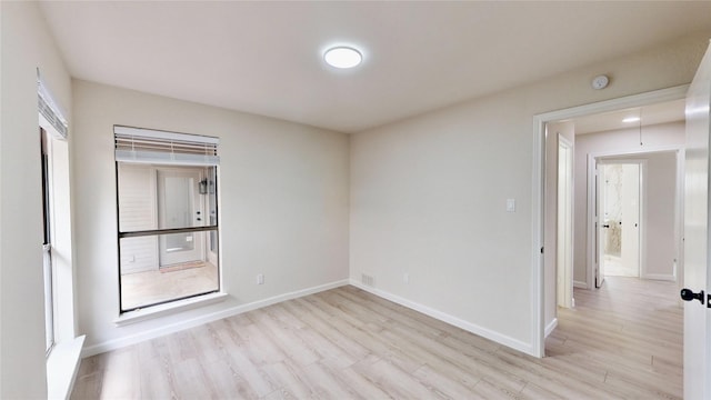 6916 Moccasin Dr, Plano, TX 75023 - spare room featuring light wood-style floors, baseboards, and a smoke detector