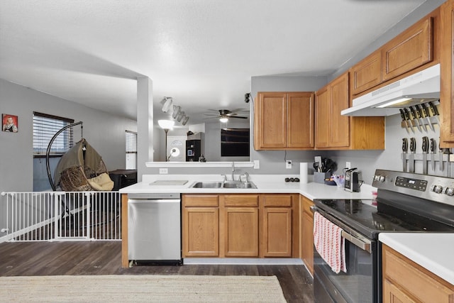 848 Cats Eye Dr, Fort Worth, TX 76179 - kitchen featuring stainless steel appliances, under cabinet range hood, dark wood-style flooring, a sink, and ceiling fan