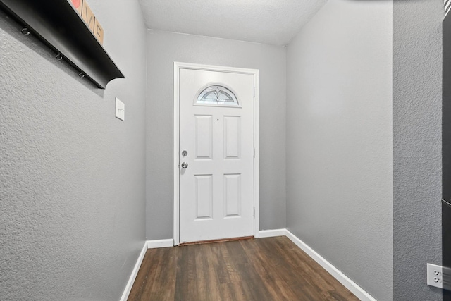 848 Cats Eye Dr, Fort Worth, TX 76179 - doorway to outside with dark wood finished floors, baseboards, and a textured wall
