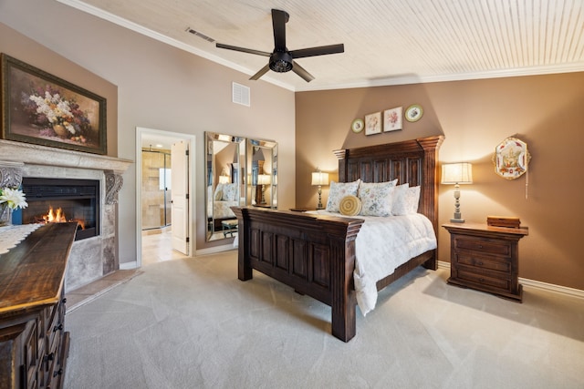 222 Bayne Rd, Haslet, TX 76052 - bedroom with light carpet, crown molding, a glass covered fireplace, ensuite bathroom, and baseboards