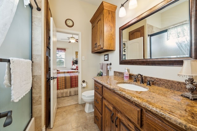 222 Bayne Rd, Haslet, TX 76052 - bathroom with vanity, toilet, ensuite bathroom, and ceiling fan